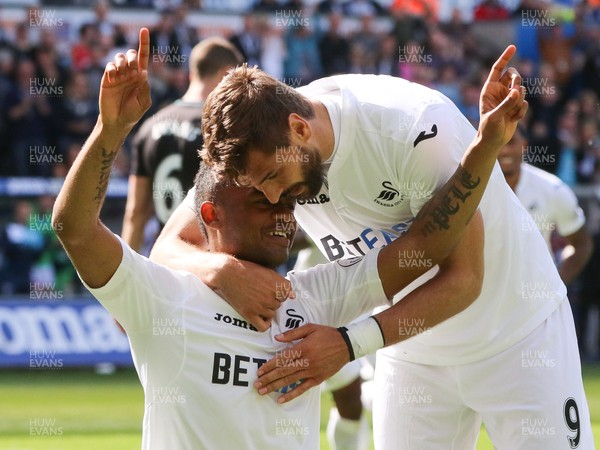 210517 - Swansea City v West Bromwich Albion, Premier League - Jordan Ayew of Swansea City  celebrates with Fernando Llorente of Swansea City after scoring goal