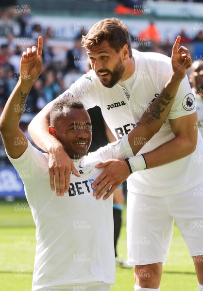 210517 - Swansea City v West Bromwich Albion, Premier League - Jordan Ayew of Swansea City  celebrates with Fernando Llorente of Swansea City after scoring goal