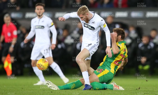 281118 - Swansea City v West Bromwich Albion - SkyBet Championship - Oli McBurnie of Swansea City is tackled by Craig Dawson of West Bromwich Albion