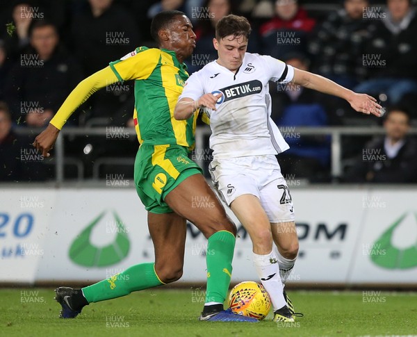 281118 - Swansea City v West Bromwich Albion - SkyBet Championship - Daniel James of Swansea City is tackled by Tosin Adarabioyo of West Bromwich Albion