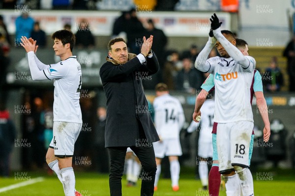 030318 - Swansea City v West Ham United  - Premier League - Carlos Carvalhal, Manager of Swansea City applauds Swansea fans after final whistle  