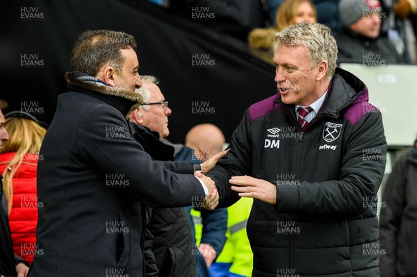 030318 - Swansea City v West Ham United  - Premier League - Carlos Carvalhal, Manager of Swansea City  shakes hands with David Moyes, Manager of West Ham United 