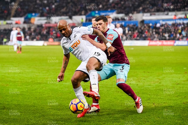 030318 - Swansea City v West Ham United  - Premier League - Andre Ayew of Swansea City and Aaron Cresswell of West Ham battle for the ball 