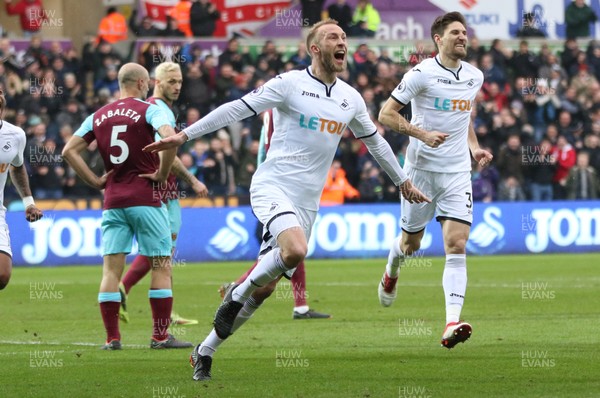 030318 - Swansea City v West Ham United, Premier League - Mike van der Hoorn of Swansea City celebrates after scoring the second goal