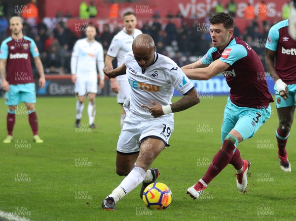030318 - Swansea City v West Ham United, Premier League - Andre Ayew of Swansea City takes on Aaron Cresswell of West Ham United