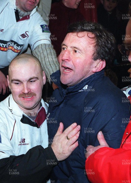 130199 - Swansea City v West Ham United - FA Cup Third Round Replay - Manager John Hollins celebrates at the end of the match