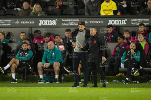 051122 - Swansea City v Wigan Athletic - Sky Bet Championship - Swansea City manager Russell Martin with fourth official Keith Stroud