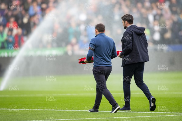 051122 - Swansea City v Wigan Athletic - Sky Bet Championship - Swansea City manager Russell Martin & Wigan Athletic manager Leam Richardson lay wreaths on the pitch ahead of kick off