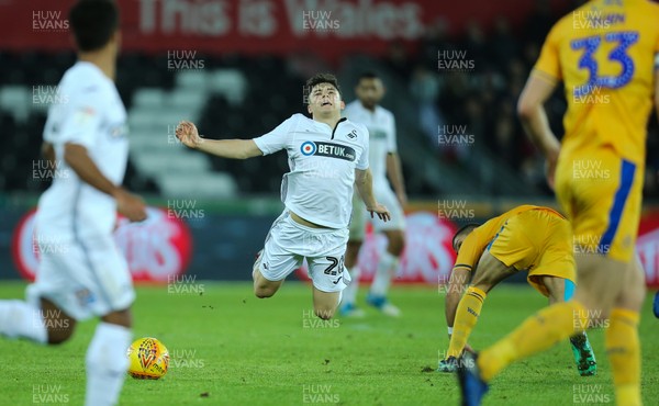 291218 - Swansea City v Wigan Athletic, SkyBet Championship - Daniel James of Swansea City is tackled