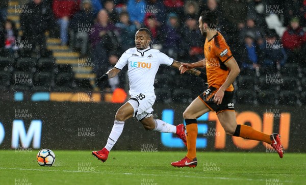 170118 - Swansea City v Wolverhampton Wanderers - FA Cup Replay - Jordan Ayew of Swansea City is tackled by Roderick Miranda of Wolverhampton Wanderers