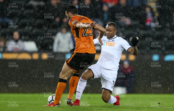 170118 - Swansea City v Wolverhampton Wanderers - FA Cup Replay - Jordan Ayew of Swansea City is tackled by Roderick Miranda of Wolverhampton Wanderers