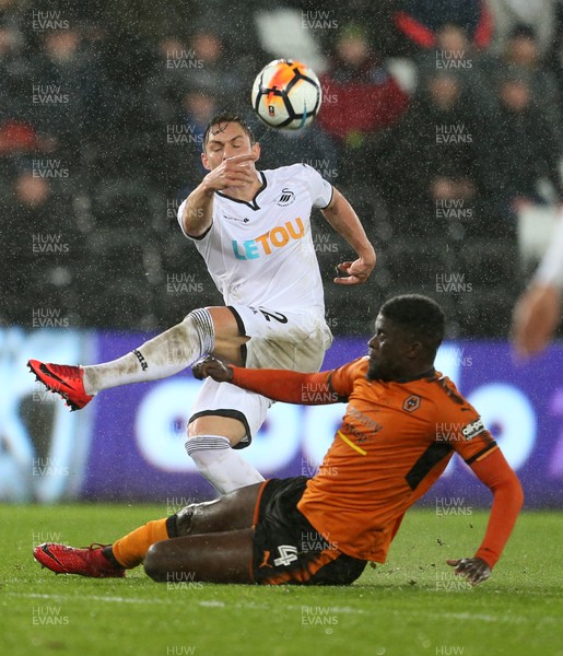 170118 - Swansea City v Wolverhampton Wanderers - FA Cup Replay - Connor Roberts of Swansea City is tackled by Alfred N'Diaye of Wolverhampton Wanderers