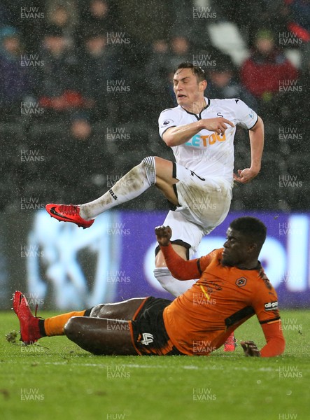 170118 - Swansea City v Wolverhampton Wanderers - FA Cup Replay - Connor Roberts of Swansea City is tackled by Alfred N'Diaye of Wolverhampton Wanderers