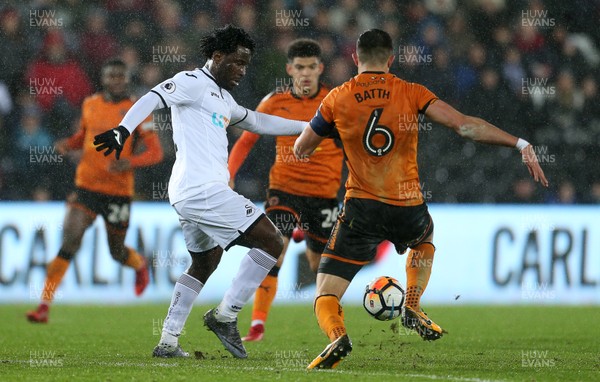 170118 - Swansea City v Wolverhampton Wanderers - FA Cup Replay - Wilfried Bony of Swansea City is tackled by Danny Batth of Wolverhampton Wanderers
