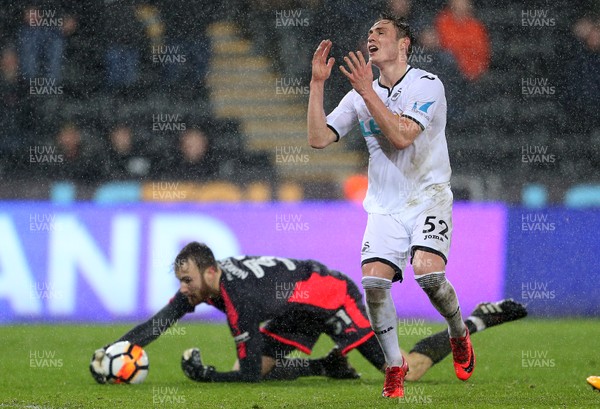 170118 - Swansea City v Wolverhampton Wanderers - FA Cup Replay - Connor Roberts of Swansea City is beaten to the ball by keeper Will Norris of Wolverhampton Wanderers