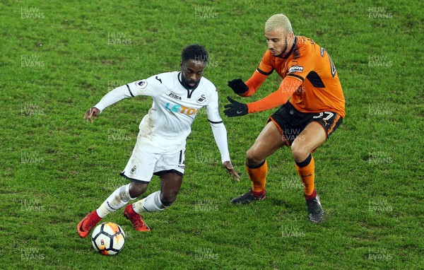 170118 - Swansea City v Wolverhampton Wanderers - FA Cup Replay - Nathan Dyer of Swansea City is challenged by Romain Saiss of Wolverhampton Wanderers