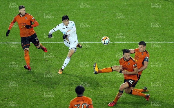 170118 - Swansea City v Wolverhampton Wanderers - FA Cup Replay - Ki Sung-Yueng of Swansea City takes a shot at goal