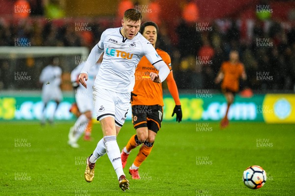 170118 - Swansea City v Wolverhampton Wonderers, FA CUP Replay - Alfie Mawson of Swansea City moves the ball upfield 