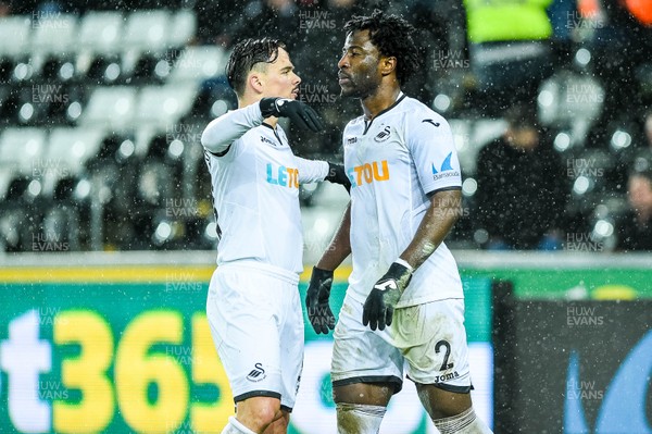 170118 - Swansea City v Wolverhampton Wonderers, FA CUP Replay -Roque Mesa of Swansea City  and Wilfried Bony of Swansea City Celebrate the second goal 