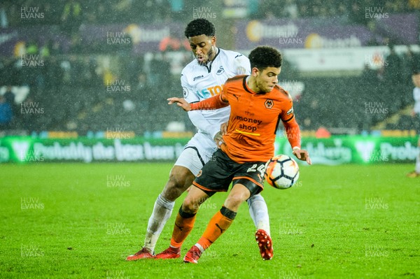170118 - Swansea City v Wolverhampton Wonderers, FA CUP Replay - Leroy Fer of Swansea City tries to take the ball from Morgan Gibbs White of Wolverhampton Wanderers 