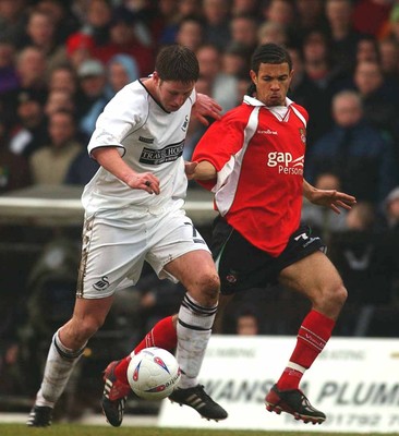 010203 - Swansea City v Wrexham - Third Division - Swansea's Andrew Mumford tries to out pace Carlos Edwards