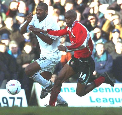 010203 - Swansea City v Wrexham - Third Division - Wrexham's Paul Edwards tries to clear the ball from John Williams