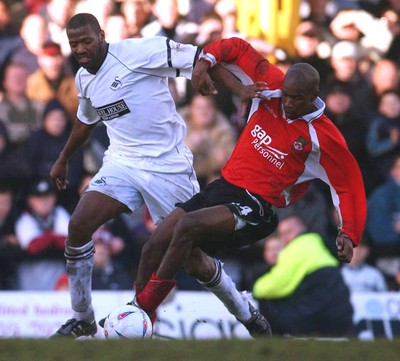 010203 - Swansea City v Wrexham - Third Division - Wrexham's Paul Edwards goes down as he gets challenged by John Williams