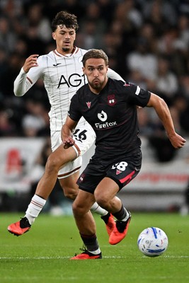050926 - Swansea City v Wrexham - Sky Bet Championship - Filip Lissah of Swansea City is challenged by Ben Whiteman of Wrexham