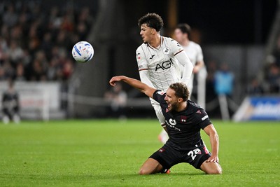 050926 - Swansea City v Wrexham - Sky Bet Championship - Filip Lissah of Swansea City is challenged by Sam Smith of Wrexham