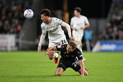 050926 - Swansea City v Wrexham - Sky Bet Championship - Filip Lissah of Swansea City is challenged by Sam Smith of Wrexham