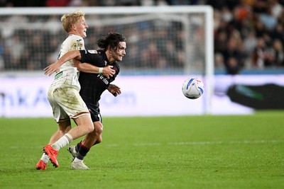 050926 - Swansea City v Wrexham - Sky Bet Championship - Melker Widell of Swansea City is challenged by Callum O'Hare of Wrexham