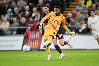 050926 - Swansea City v Wrexham - Sky Bet Championship - Lawrence Vigouroux of Swansea City is challenged by Kieffer Moore of Wrexham
