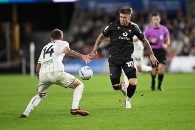 050926 - Swansea City v Wrexham - Sky Bet Championship - Josh Windass of Wrexham is challenged by Josh Tymon of Swansea City