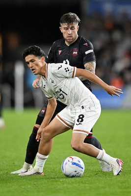 050926 - Swansea City v Wrexham - Sky Bet Championship - Elijah Just of Swansea City is challenged by Josh Windass of Wrexham