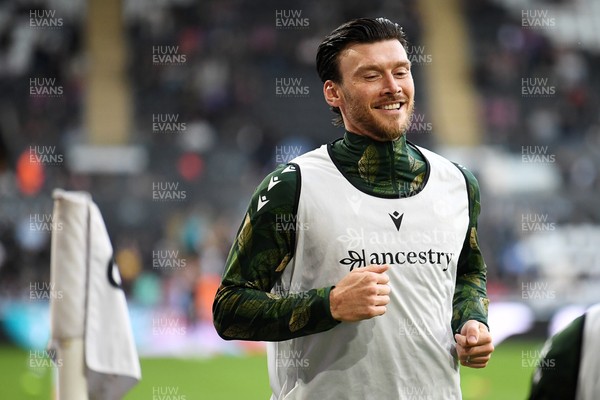 050926 - Swansea City v Wrexham - Sky Bet Championship - Kieffer Moore of Wrexham gestures to the Swansea fans during the warmup