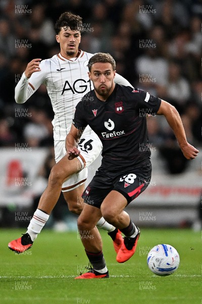 050926 - Swansea City v Wrexham - Sky Bet Championship - Filip Lissah of Swansea City is challenged by Ben Whiteman of Wrexham