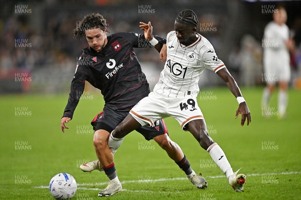 050926 - Swansea City v Wrexham - Sky Bet Championship - Moussa Yeo of Swansea City is challenged by Callum O'Hare of Wrexham
