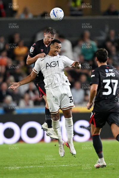050926 - Swansea City v Wrexham - Sky Bet Championship - Dominic Hyam of Wrexham is challenged by Adam Idah of Swansea City