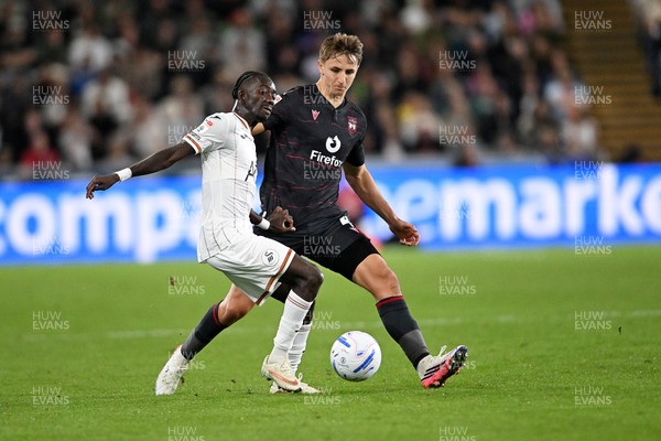 050926 - Swansea City v Wrexham - Sky Bet Championship - Moussa Yeo of Swansea City is challenged by Max Cleworth of Wrexham