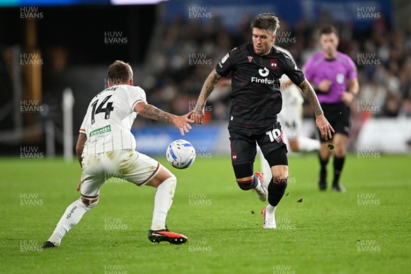 050926 - Swansea City v Wrexham - Sky Bet Championship - Josh Windass of Wrexham is challenged by Josh Tymon of Swansea City