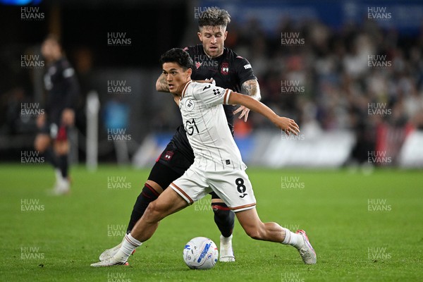 050926 - Swansea City v Wrexham - Sky Bet Championship - Elijah Just of Swansea City is challenged by Josh Windass of Wrexham