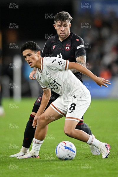 050926 - Swansea City v Wrexham - Sky Bet Championship - Elijah Just of Swansea City is challenged by Josh Windass of Wrexham
