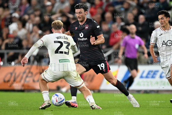 050926 - Swansea City v Wrexham - Sky Bet Championship - Kieffer Moore of Wrexham is challenged by Stephen Welsh of Swansea City