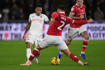 191225 - Swansea City v Wrexham - Sky Bet Championship - Ronald of Swansea City is challenged by Callum Doyle of Wrexham