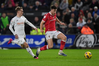 191225 - Swansea City v Wrexham - Sky Bet Championship - George Thomason of Wrexham is challenged by Ethan Galbraith of Swansea City