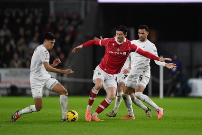 191225 - Swansea City v Wrexham - Sky Bet Championship - Kieffer Moore of Wrexham is challenged by Ben Cabango of Swansea City