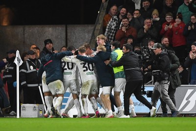 191225 - Swansea City v Wrexham - Sky Bet Championship - Adam Idah of Swansea City celebrates scoring a goal with team mates