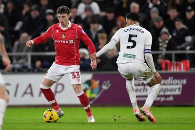 191225 - Swansea City v Wrexham - Sky Bet Championship - Nathan Broadhead of Wrexham is challenged by Ben Cabango of Swansea City