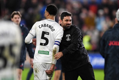 191225 - Swansea City v Wrexham - Sky Bet Championship - Vitor Matos, Swansea Head Coach celebrates the win at full time with Ben Cabango of Swansea City