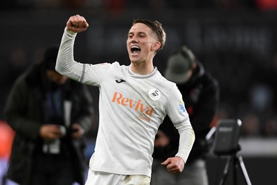 191225 - Swansea City v Wrexham - Sky Bet Championship - Ethan Galbraith of Swansea City celebrates the win at full time